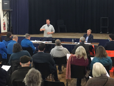 Guy Opperman addresses people at a public meeting about Storm Arwen